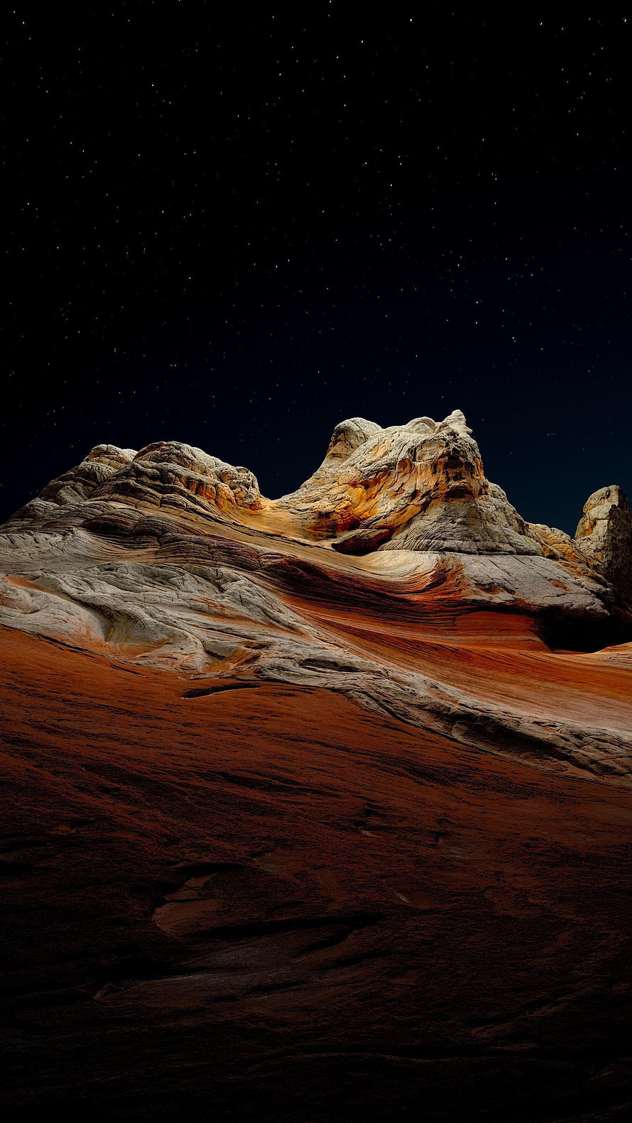 Dramatic Desert Rock Formation Under a Starry Night Sky HD phone wallpaper