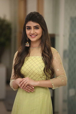 Pooja Hegde in a stunning light green traditional outfit with gold embroidery and elegant jewelry HD phone wallpaper