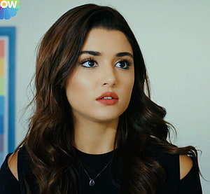 Hande Erçel in Black Cold Shoulder Top with Long Wavy Hair and Delicate Necklace HD wallpaper
