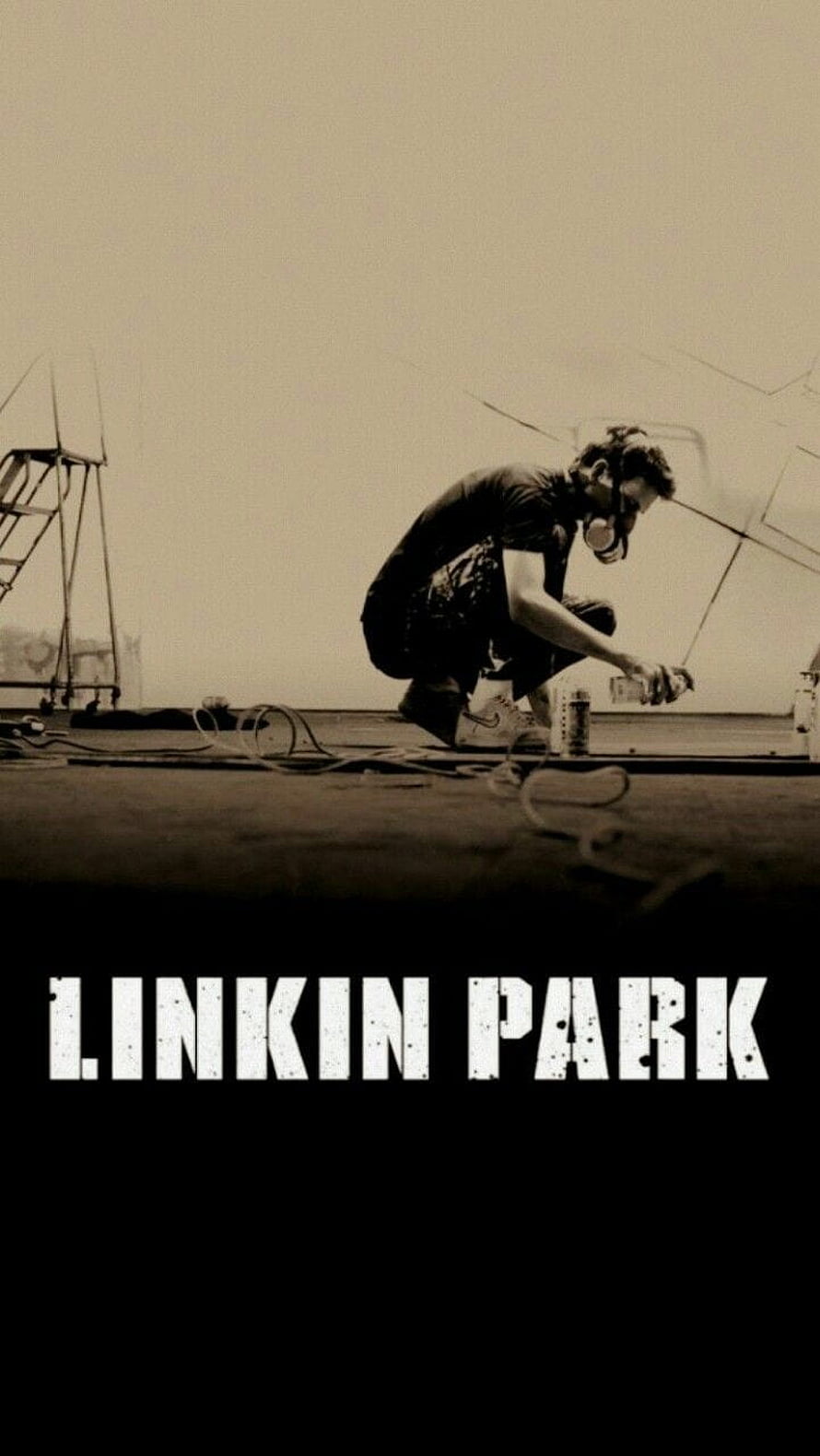 Linkin Park Meteora Album Artwork: Sepia-Toned Artist Crouching with Spray Paint on Rooftop HD phone wallpaper