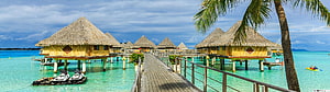 Tropical Overwater Bungalows With Thatched Roofs And Wooden Boardwalk HD wallpaper