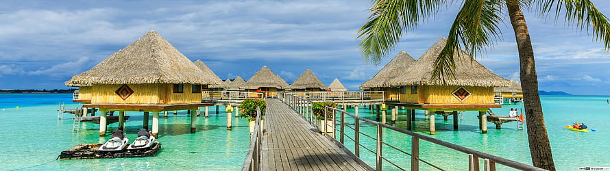 Tropical Overwater Bungalows With Thatched Roofs And Wooden Boardwalk HD wallpaper