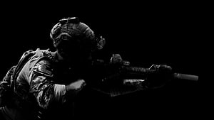 Tactical Soldier in Full Combat Gear Aiming Rifle in Dramatic Black and White HD wallpaper