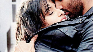 Aashiqui 2 Romantic Embrace Scene with Intimate Close-Up of Lovers in Leather Jacket HD wallpaper