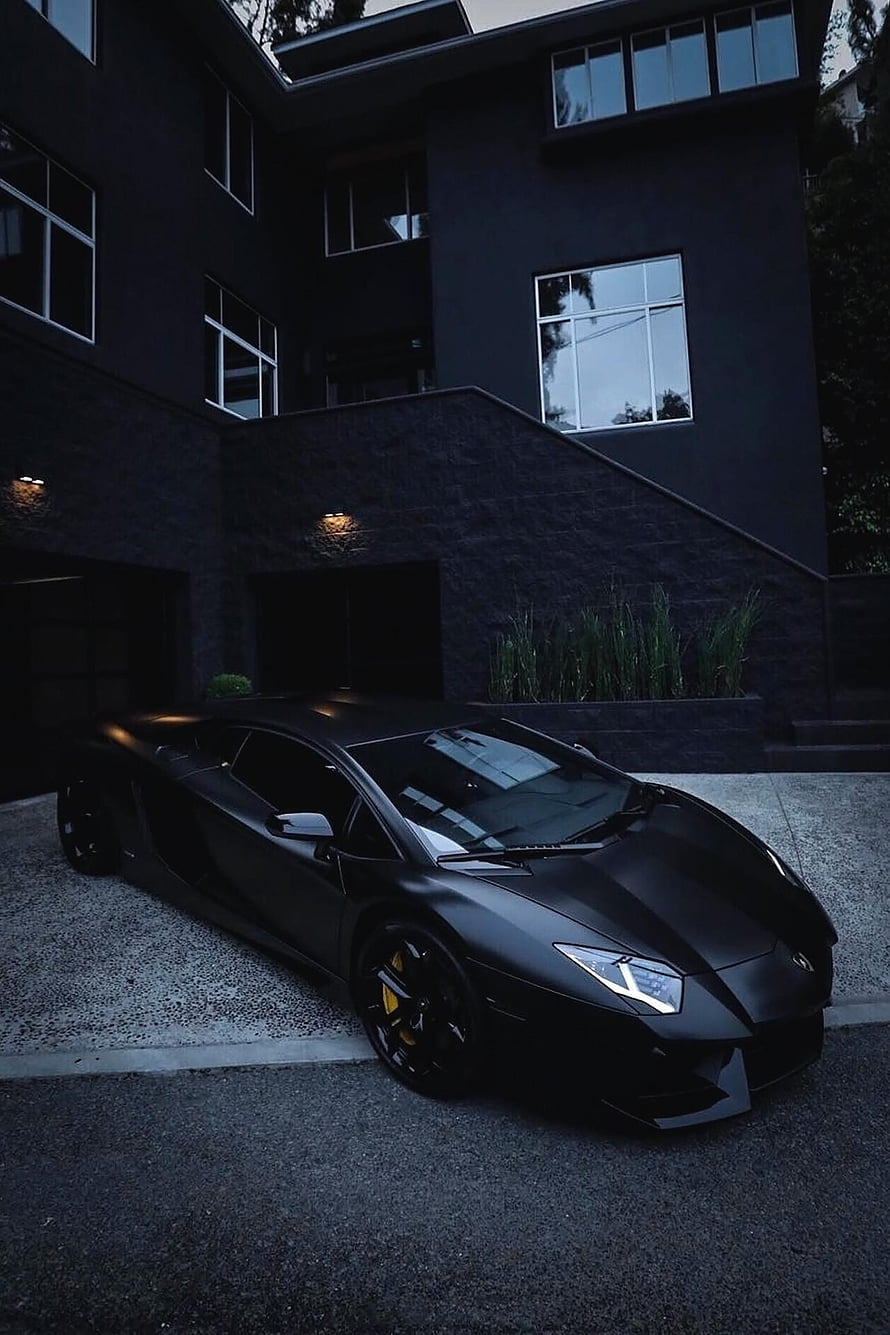 Matte Black Lamborghini Aventador Parked in Front of Modern Dark Residence at Dusk HD phone wallpaper