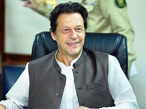 Portrait of Imran Khan Sitting in a Chair Wearing a Traditional Vest HD wallpaper