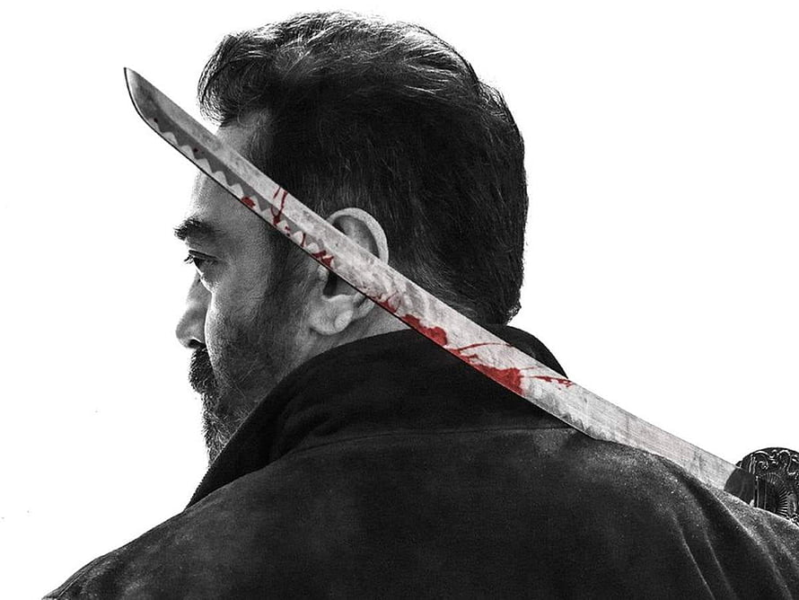 Kamal Haasan as Vikram with Blood-Stained Sword in Dramatic Black and White Profile HD wallpaper