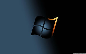 Windows 7 Dark Logo with Golden Accent on Black Background HD wallpaper