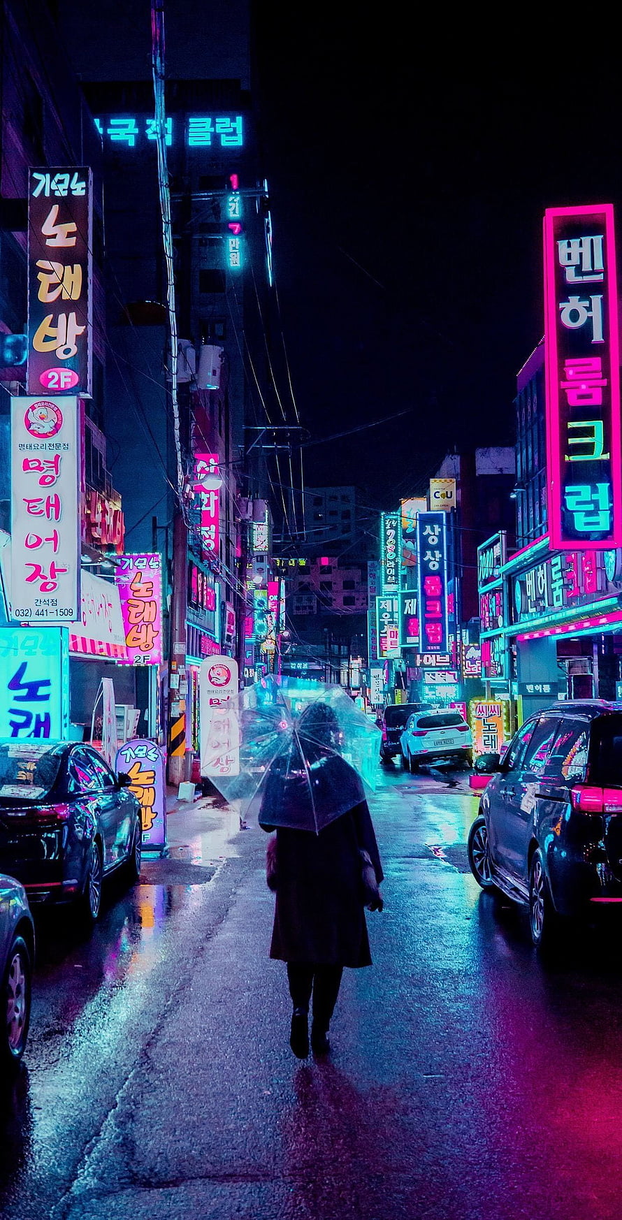 Lone figure with umbrella walking down neon-lit Korean street at night HD phone wallpaper