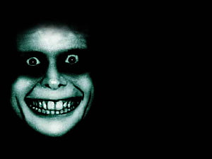 Eerie Glowing Face With Wide Grin in Dark Void HD wallpaper