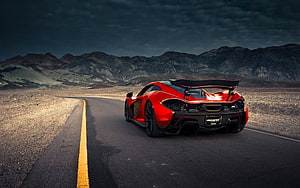 Red McLaren P1 Super Car Driving on Desert Highway with Mountains HD wallpaper