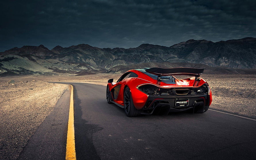Red McLaren P1 Super Car Driving on Desert Highway with Mountains HD wallpaper