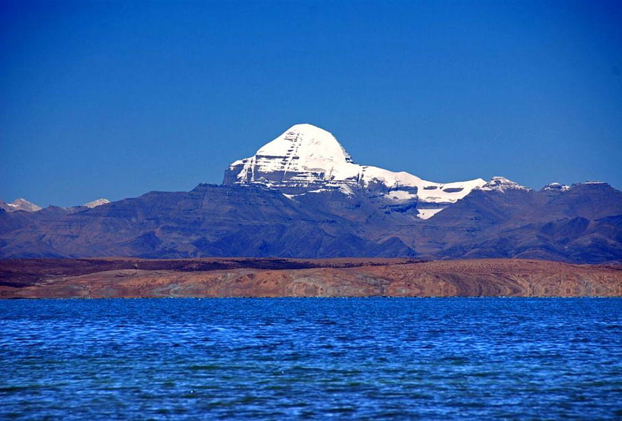 Mount Kailash Rising Above Lake Mansarovar in the Himalayas HD wallpaper