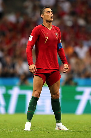 Cristiano Ronaldo in Portugal National Team Kit on the Soccer Pitch HD phone wallpaper