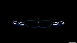 BMW Front Grille and LED Headlights Illuminated in Darkness HD wallpaper