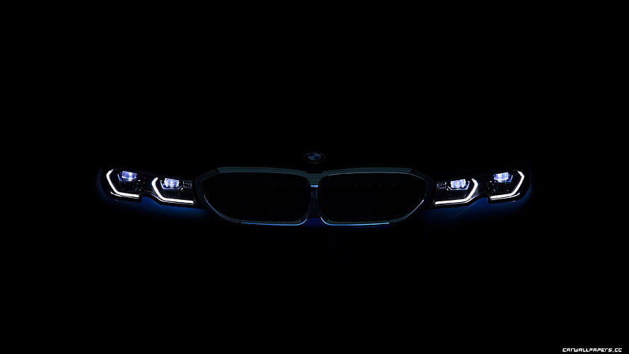 BMW Front Grille and LED Headlights Illuminated in Darkness HD wallpaper