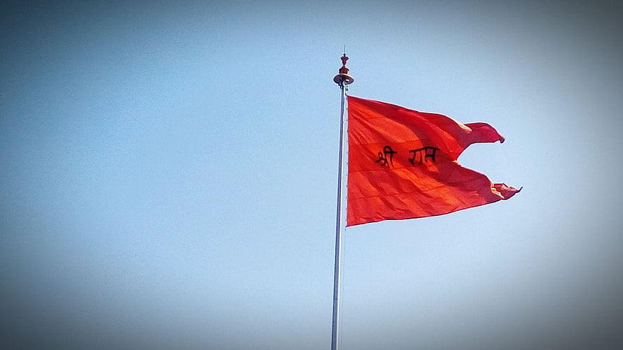 Bhagwa Flag Flying at Ram Mandir Against a Clear Blue Sky HD wallpaper