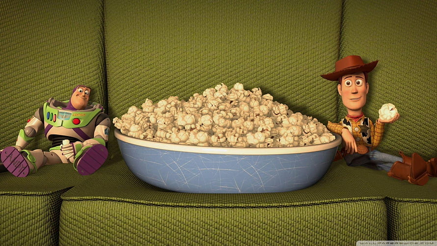 Toy Story Buzz Lightyear and Woody Sitting on a Green Couch with a Large Bowl of Popcorn HD wallpaper