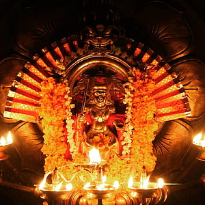 Vishnumaya Temple Deity Adorned With Marigold Garlands And Oil Lamps HD phone wallpaper