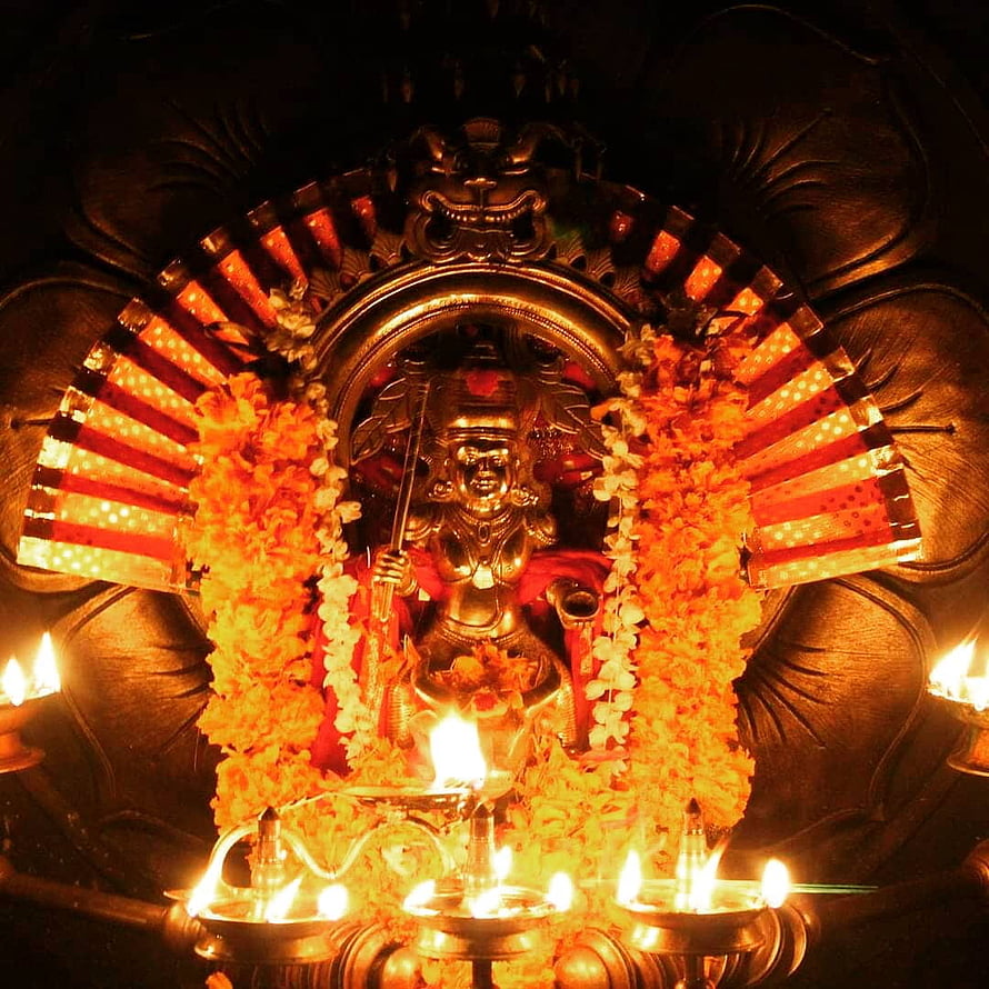 Vishnumaya Temple Deity Adorned With Marigold Garlands And Oil Lamps HD phone wallpaper