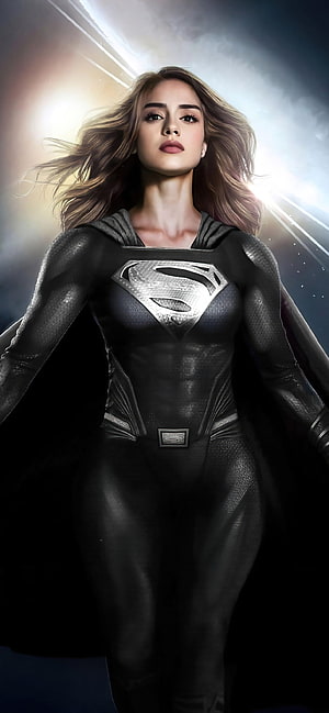 Sasha Calle as Supergirl in Black Suit with Dramatic Backlight and Flowing Hair HD phone wallpaper
