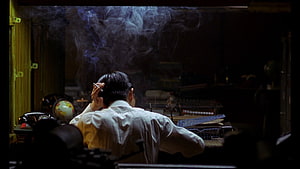 In The Mood For Love cinematic still of a man smoking in a dimly lit room, In The Mood For Love} by Wong Kar, wong kar wai HD wallpaper