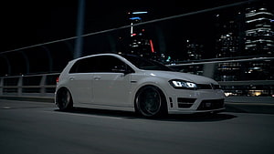 White Volkswagen Golf R MK7 Stance Build on a Nighttime City Bridge HD wallpaper