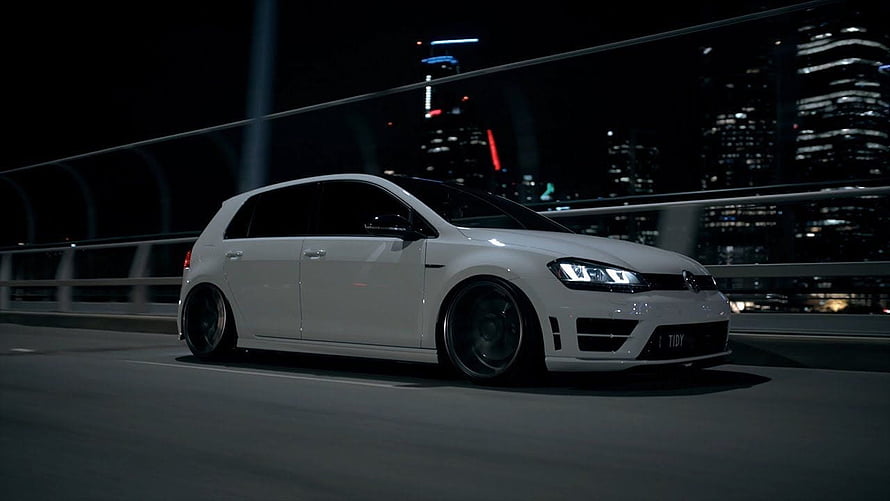 White Volkswagen Golf R MK7 Stance Build on a Nighttime City Bridge HD wallpaper
