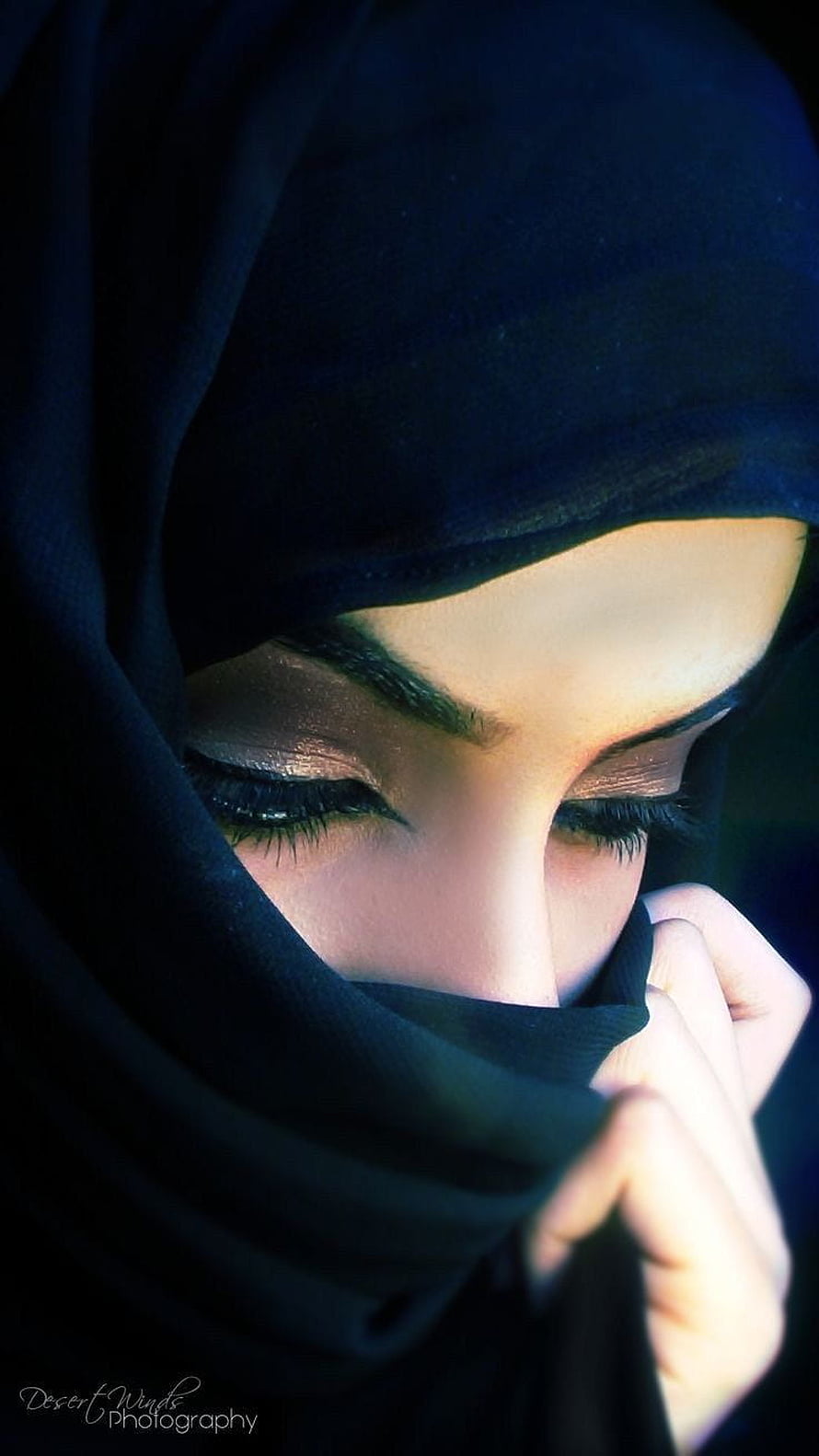 Close-up portrait of a woman in a black hijab with dramatic eye makeup and soft lighting, Eyes Pic In Hijab, graphy hijab girl eyes HD phone wallpaper