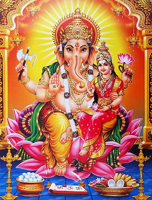 Ganesha and Riddhi Siddhi Seated on Lotus with Offerings and Divine Aura HD phone wallpaper