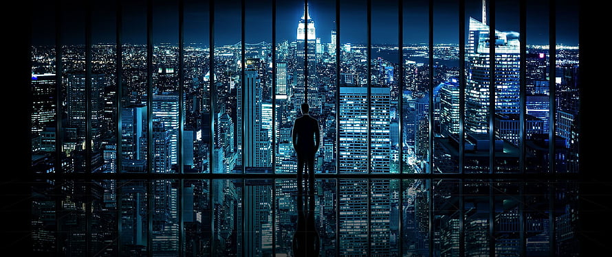Silhouette of a businessman standing in a high-rise office overlooking a glowing city skyline at night, The Best 24 Super Ultrawide 5120X1440 HD wallpaper