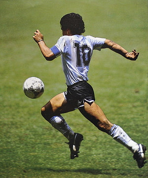 Diego Maradona in Action During a Classic World Cup Match HD phone wallpaper