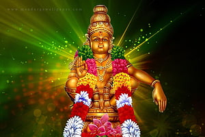 Golden Ayyappa Statue Adorned With Colorful Flower Garlands And Radiant Green Background HD wallpaper