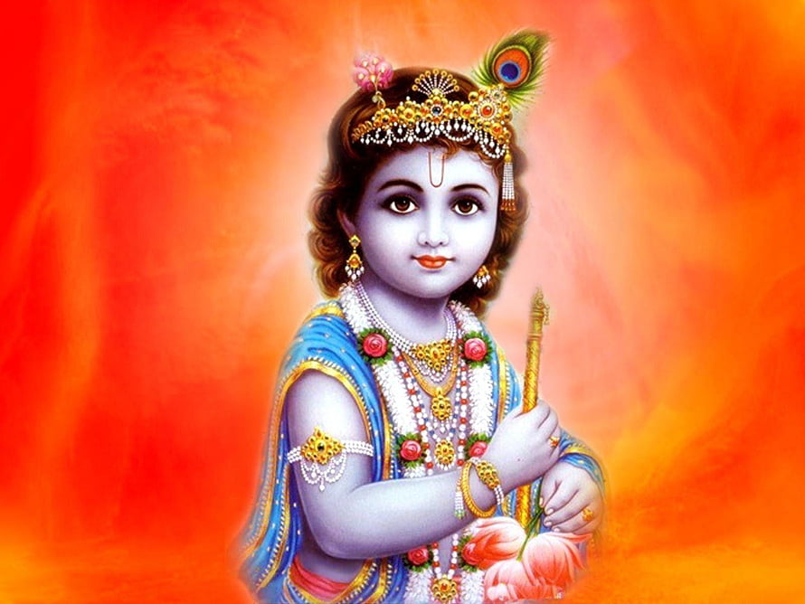 Young Krishna in ornate jewelry and peacock feather crown against a warm orange background HD wallpaper