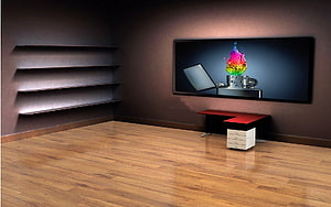 Modern minimalist home office interior with wooden flooring, dark walls, floating shelves, and a large wall-mounted screen displaying colorful abstract art HD wallpaper