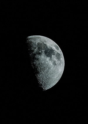 Glowing Crescent Moon In Space With Craters And Stars HD phone wallpaper