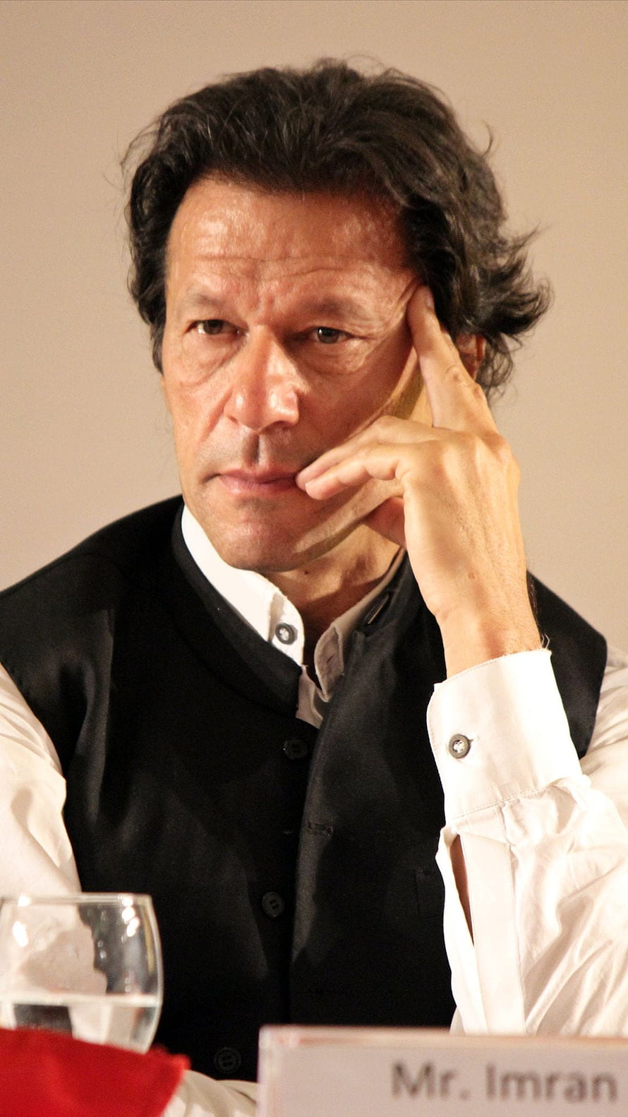 Portrait of Imran Khan in a Black Vest and White Shirt HD phone wallpaper