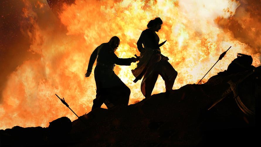 Silhouettes of Two Warriors Running Through a Massive Fire Explosion HD wallpaper