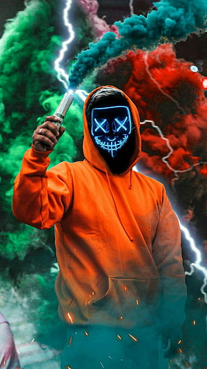 Person in Orange Hoodie Wearing LED Skull Mask with Lightning and Smoke HD phone wallpaper