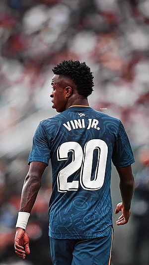 Vini Jr. in Real Madrid Blue Kit Walking on the Pitch HD phone wallpaper