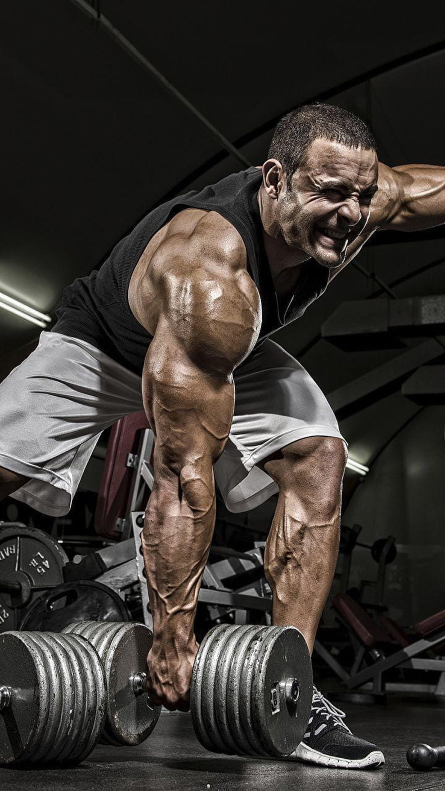 Muscular Bodybuilder Lifting Heavy Dumbbells in Dark Gym HD phone wallpaper