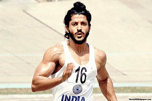 Farhan Akhtar as Milkha Singh running in white India jersey with number 16 HD wallpaper