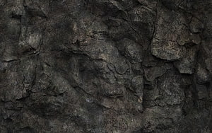 Dark Cracked Stone Surface with Rough Natural Rock Texture and Deep Gray Tones HD wallpaper
