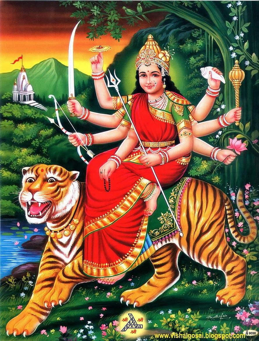 Goddess Durga riding a tiger holding trident, sword, and bow in a lush forest landscape HD phone wallpaper