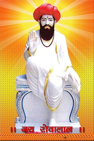 Sevalal Maharaj Statue in White Robes and Red Turban with Radiant Golden Background HD phone wallpaper