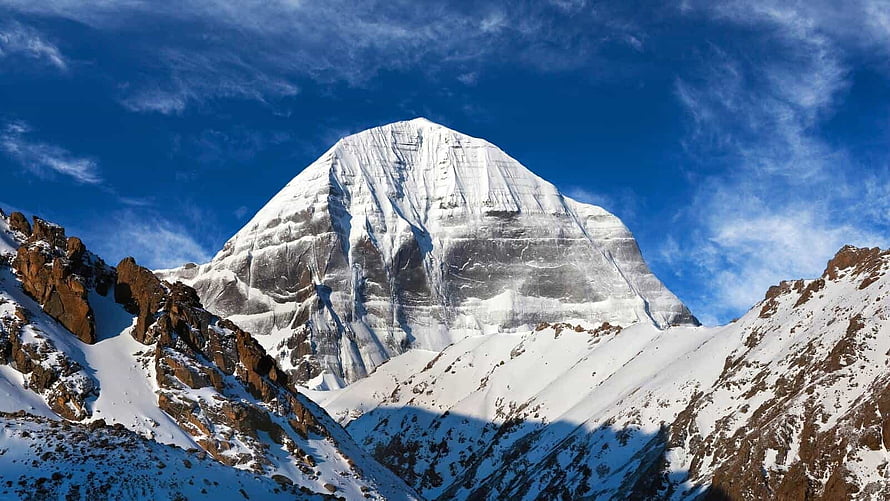 Majestic Mount Kailash Snow-Capped Peak Against Blue Sky HD wallpaper