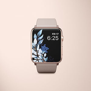 Apple Watch with Rose Gold Case and Floral Blue Leaf Watch Face on Beige Background HD phone wallpaper
