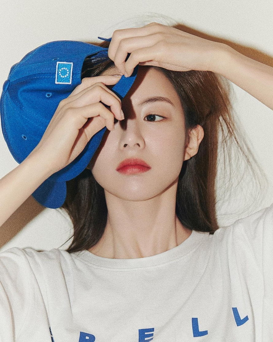 Portrait of a woman wearing a white t-shirt and holding a blue cap over her face, go yoon jung, #Go Yoon HD phone wallpaper