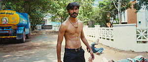 Dhanush shirtless action scene with muscular physique in Indian street setting HD wallpaper