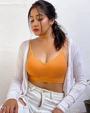 Sofia Ansari in Orange Crop Top and White Cardigan HD phone wallpaper